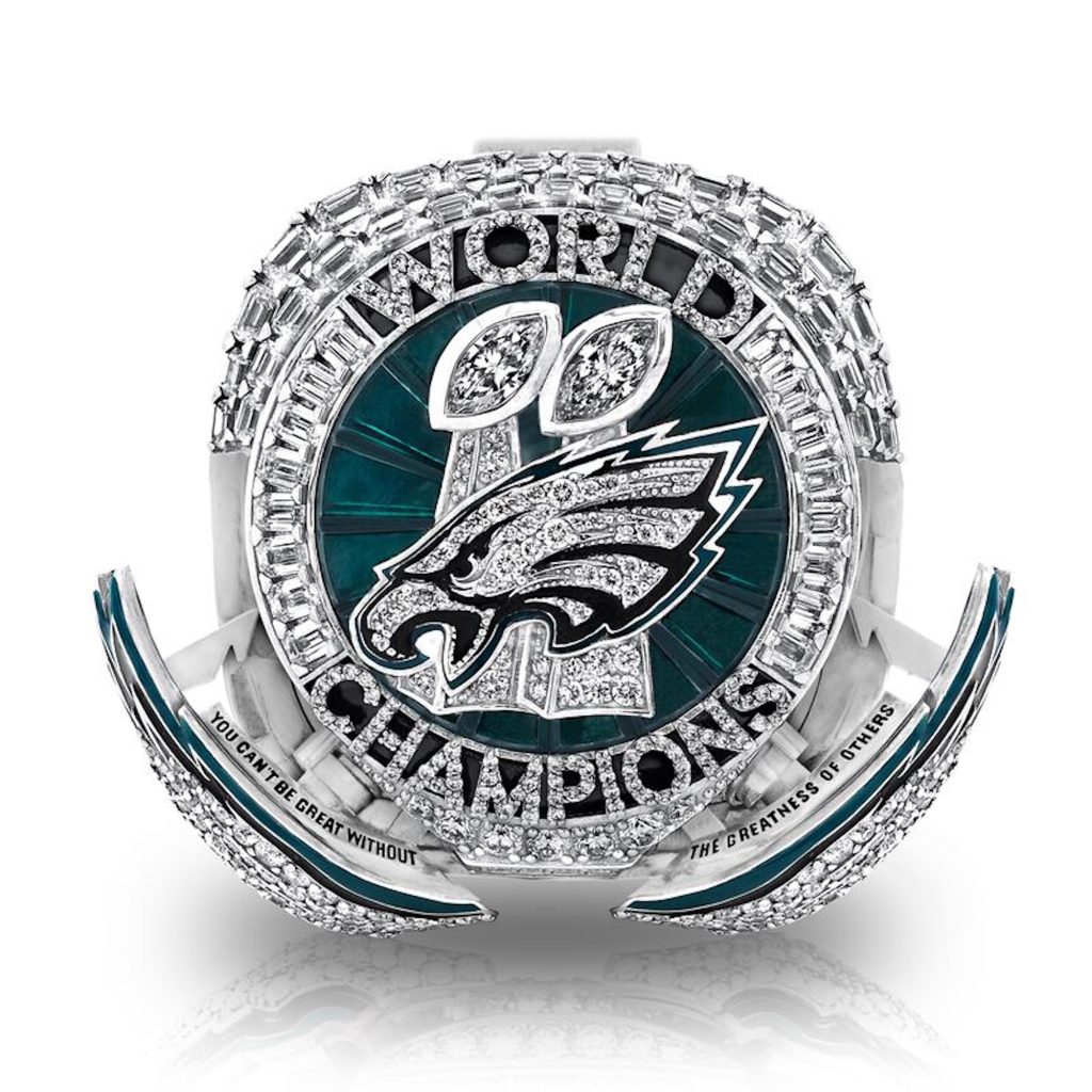 Super Bowl ring featuring the Philadelphia Eagles logo, surrounded by diamonds and inscriptions celebrating the championship.